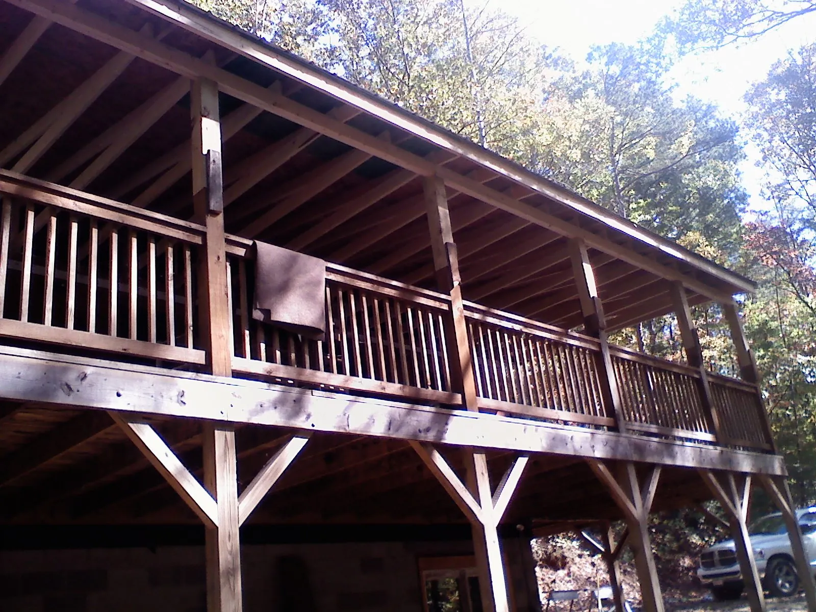 Timber framing under a new elevated porch and deck in Cedar Valley